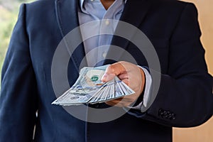 Man counting  money -  100 dollar bills