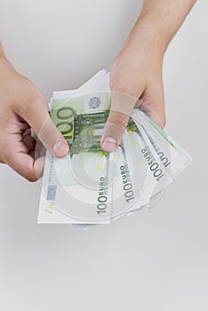 Man counting money, economy concept, allocation of money photo