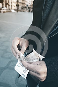 Man counting some czech koruna banknotes