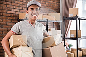 Man courier holding package work at shipping package business