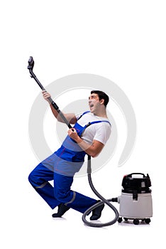 The man in coveralls doing vacuum cleaning on white