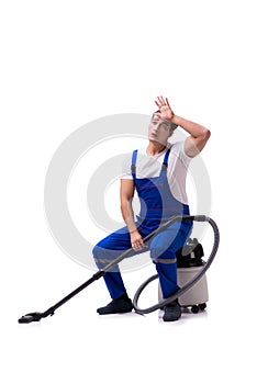 The man in coveralls doing vacuum cleaning on white