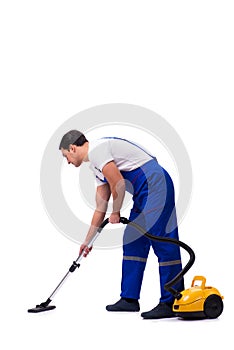 The man in coveralls doing vacuum cleaning on white