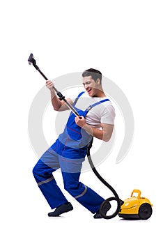 The man in coveralls doing vacuum cleaning on white