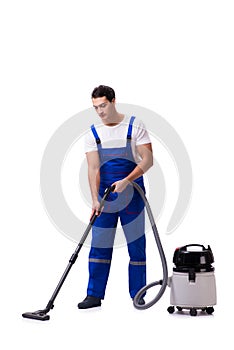 The man in coveralls doing vacuum cleaning on white