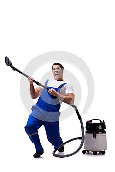 The man in coveralls doing vacuum cleaning on white