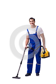The man in coveralls doing vacuum cleaning on white