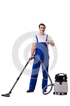 The man in coveralls doing vacuum cleaning on white