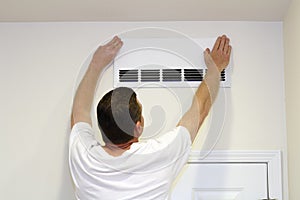 Man Covering Air Vent