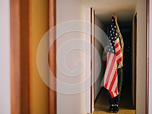 Man covering himself with the United States flag