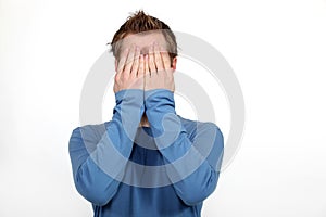 Man covering his face photo