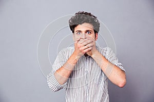 Man covering his mouth