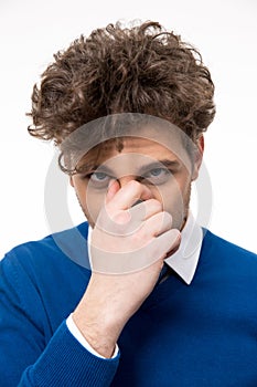 Man covering his nose