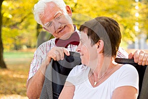 Man covering his wife