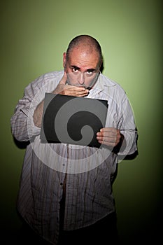 Man covering mouth in mugshot