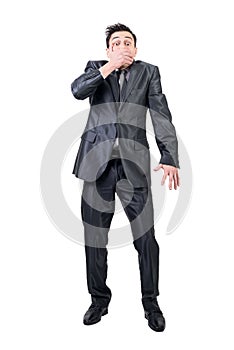 Man covering mouth in studio. White background.