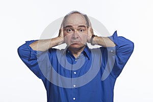 Man covers ears, horizontal