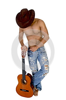 Man in cowbow hat holding guitar