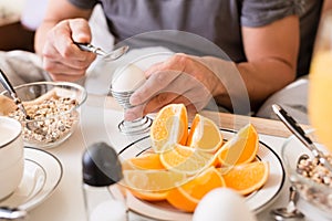 Man cracking open a boiled egg for breakfast photo