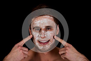 Man with cream moisturizer on his face.