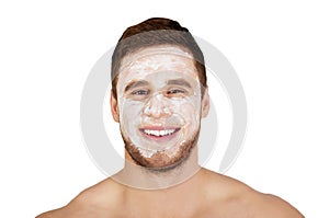 Man with cream moisturizer on his face.