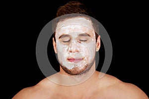 Man with cream moisturizer on his face.