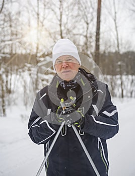 A man on cross-country skis in a winter park