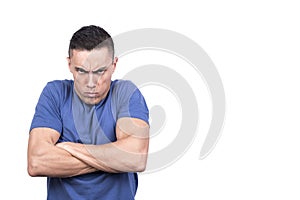 Man with crossed arms and angry scowl