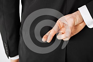 Man with crossed fingers