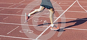 Man crossing the finish line at the track