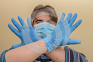 Man Crossing His Hands With His Personal Protective Equipment Indicating That He Will Not Pass The Covid-19