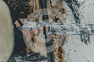 Man crossing through the wooden bridge in flip flops