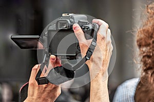 A man from a crowd shoots a street performance on a mirror camera