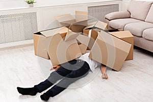 Man crushed underneath cardboard boxes