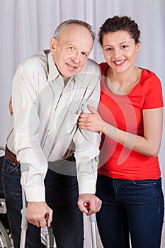 Man on crutches and his nurse