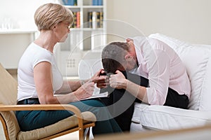 Man crying during psychological therapy