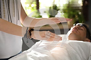 Man during crystal healing session in room