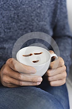 Man with a cup of cappuccino