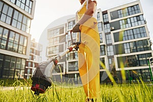 Man cut the grass with lawn mover outdoors in the yard