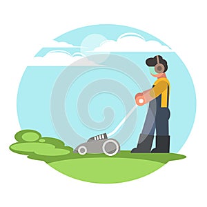 A man cuts the grass with a lawnmower