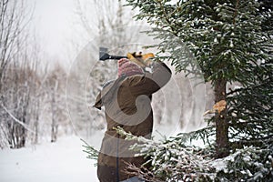 Man cuts tree