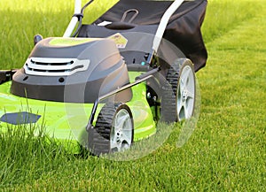 Man cutting the grass with lawn mower