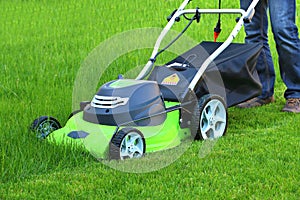 Man cutting the grass with lawn mower