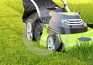 Man cutting the grass with lawn mower