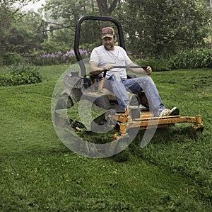 Man cutting grass on lawnmower