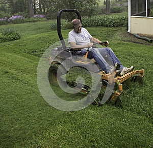 Man cutting grass on lawnmower