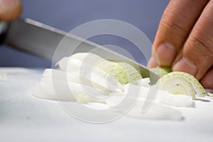 Man cutting an onion
