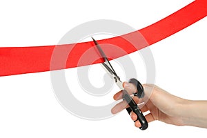 Man cutting red ribbon on white background, closeup