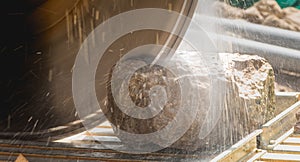 Man cutting a stone with a water saw