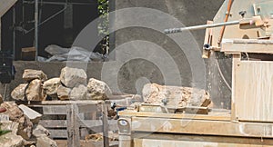 Man cutting a stone with a water saw